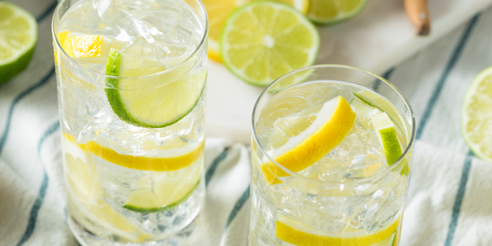 Glasses of water with lemon and lime slices