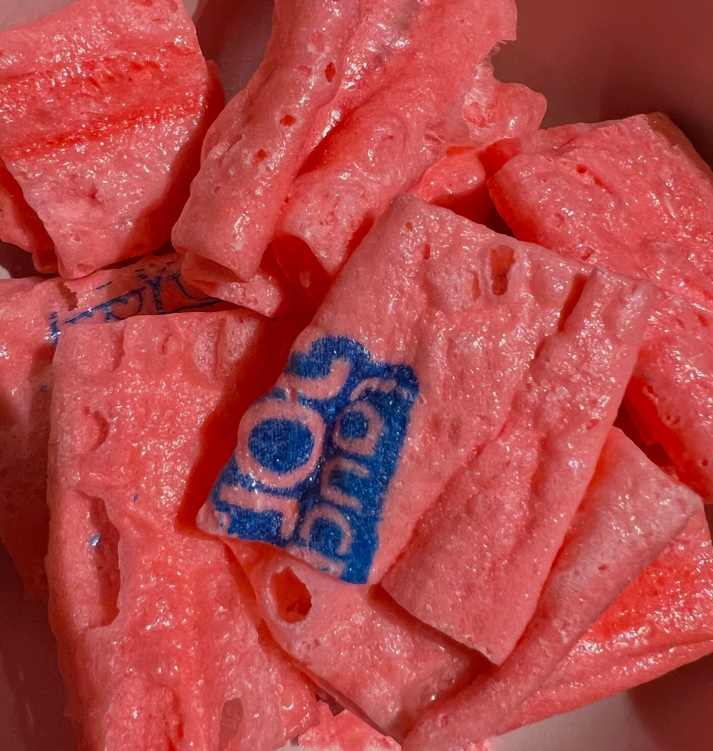 Up close view of pink freeze-dried Jolly Ranchers watermelon bark