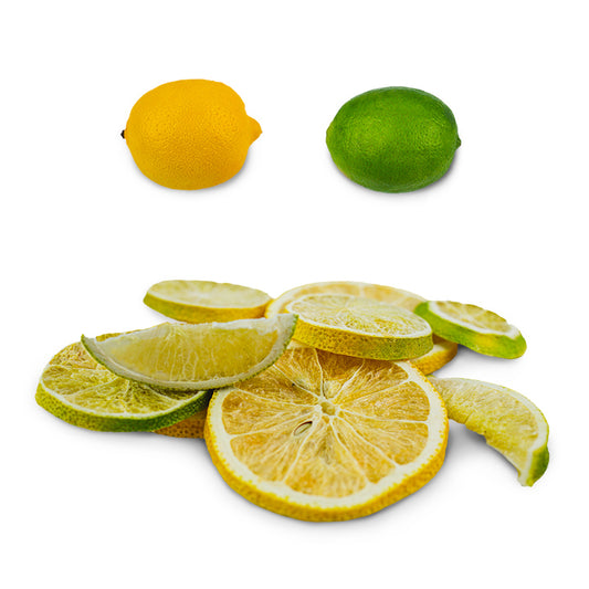 Pile of freeze-dried lemon and lime slices beside whole lemon and whole lime