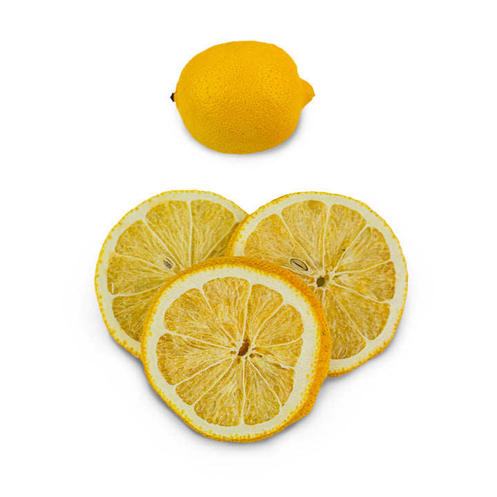 Freeze-dried lemon slices beside a whole regular lemon