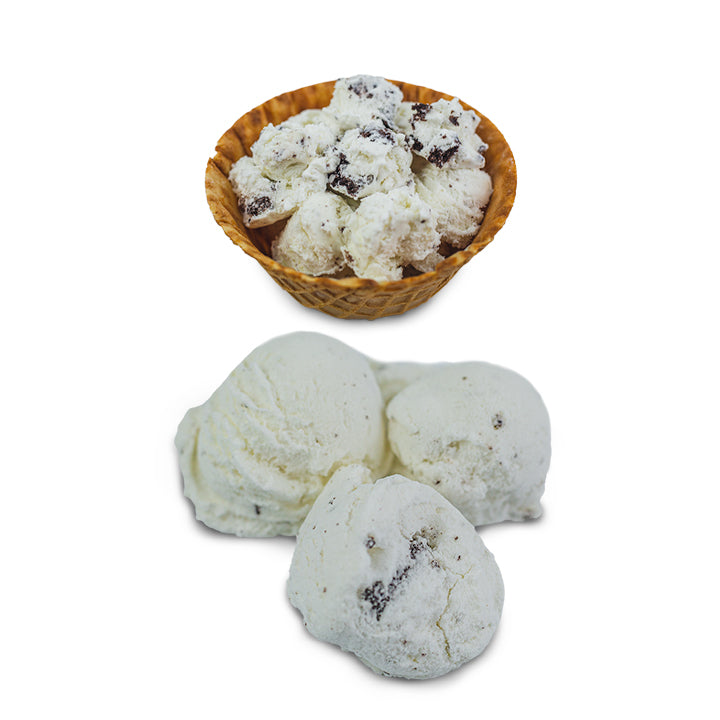 3 scoops of freeze-dried cookies and cream ice cream beside waffle bowl of regular ice cream