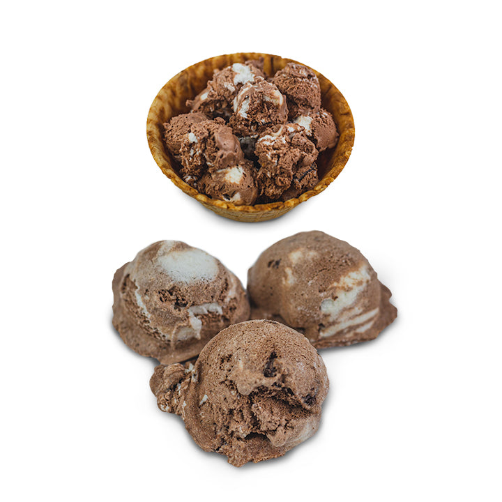 3 scoops of freeze-dried chocolate ice cream beside waffle bowl of regular ice cream