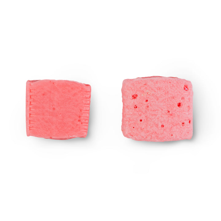 Pink freeze-dried starburst piece beside regular pink starburst